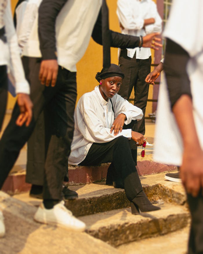 A group of fashionable young adults in Ado Ekiti, Nigeria, showcasing modern street style.